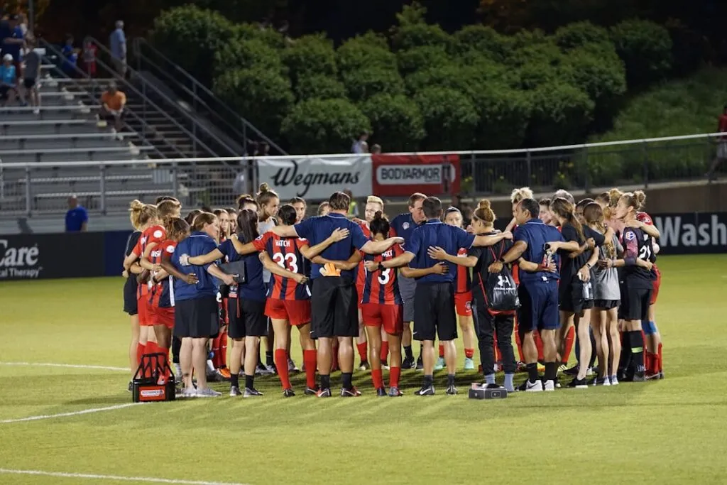Sporturi de echipă pentru dezvoltarea colaborării Photo Team huddle